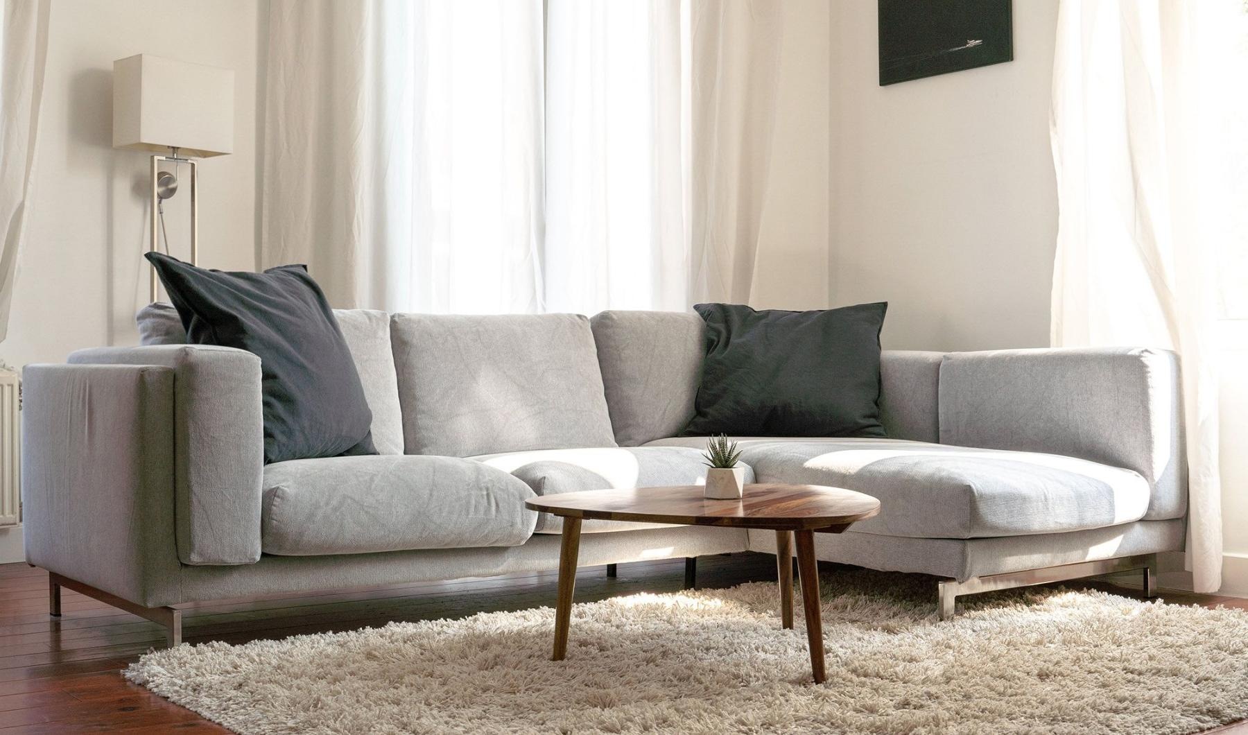 oversized windows brighten spacious, furnished living room